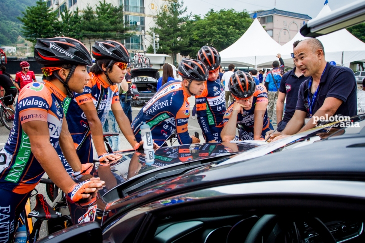 Nippo Fantini riders getting a team brief before the start of the stage